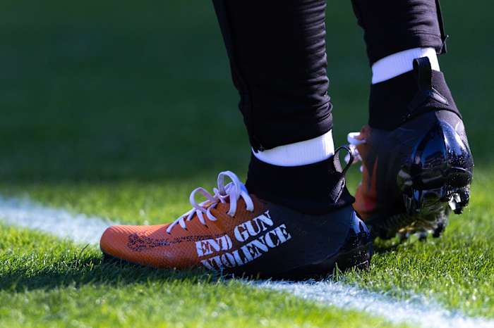 View of black and orange cleats.